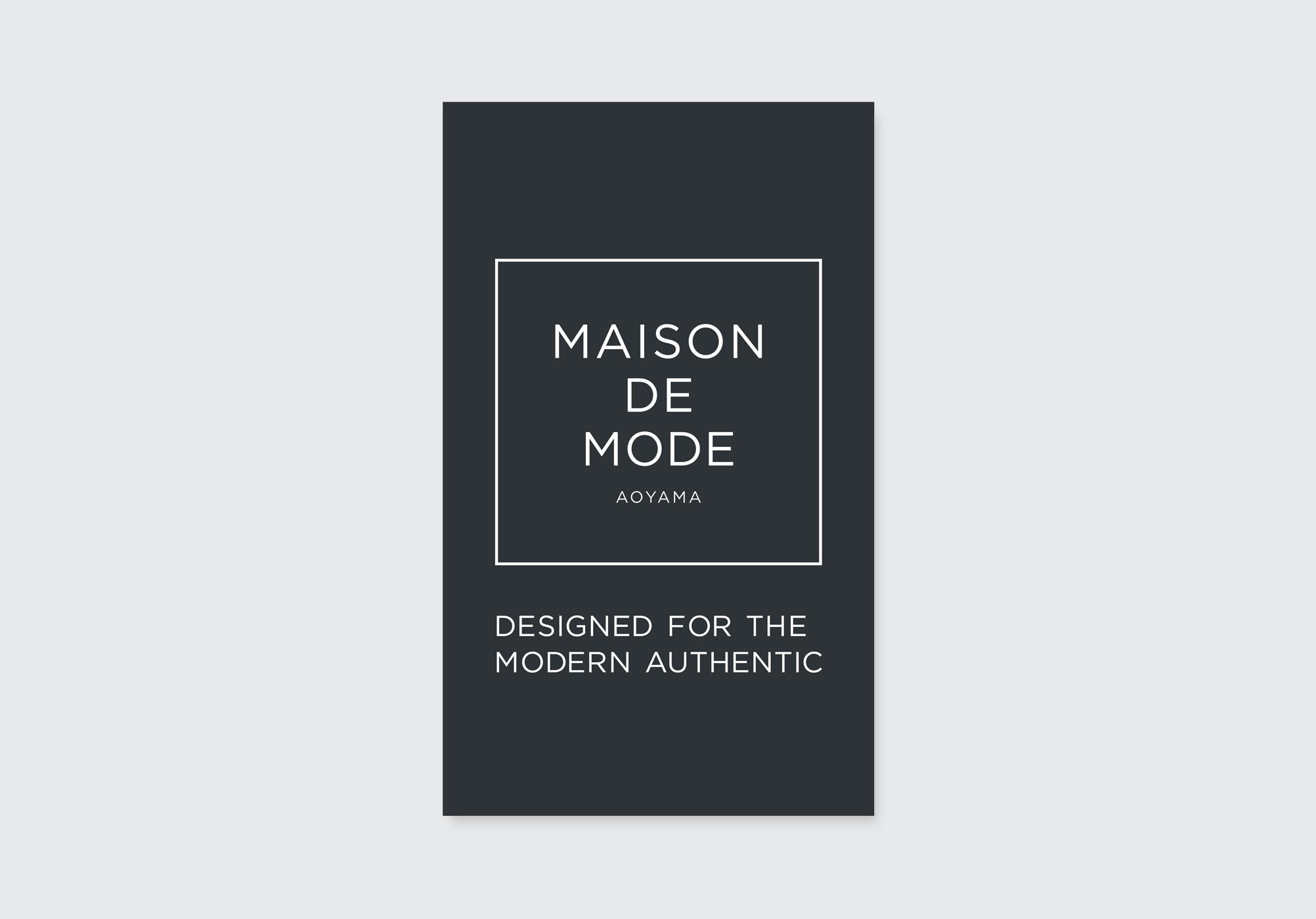 青山の美容室向けモード系名刺デザイン。MAISON DE MODEロゴとキャッチコピーを配置した高級感ある黒ベースの表面デザイン。